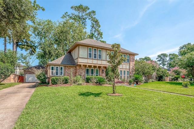 view of front facade with a front lawn and a garage