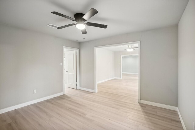 spare room featuring ceiling fan and light hardwood / wood-style flooring