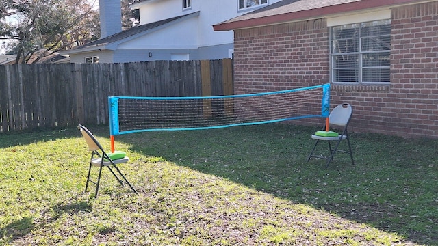 view of yard featuring volleyball court