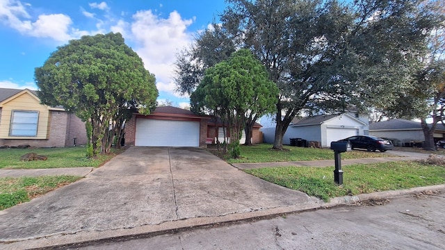 ranch-style home with a garage and a front yard