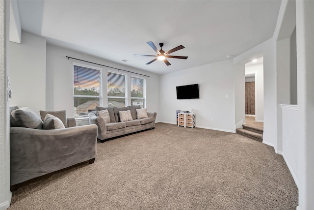 living room featuring ceiling fan and carpet flooring