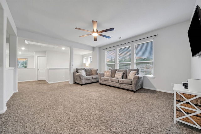 living room featuring ceiling fan and carpet flooring