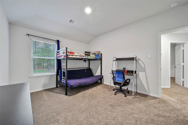 bedroom featuring carpet floors and lofted ceiling