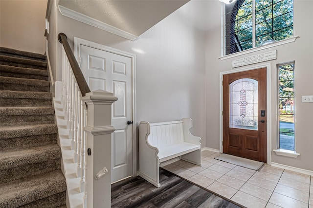 entrance foyer featuring hardwood / wood-style flooring and ornamental molding