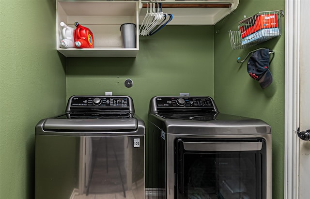 washroom with washing machine and clothes dryer