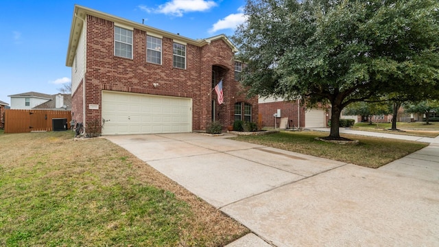 view of front of property with a garage, central AC, and a front yard