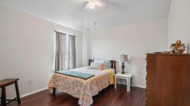 bedroom featuring ceiling fan and dark hardwood / wood-style floors