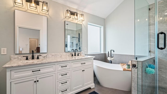 bathroom with vanity, tile patterned flooring, and shower with separate bathtub