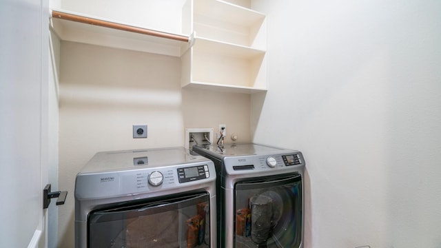 clothes washing area with washer and dryer