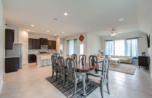 dining room featuring ceiling fan and light tile patterned flooring