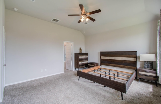 bedroom with ceiling fan, lofted ceiling, and light colored carpet