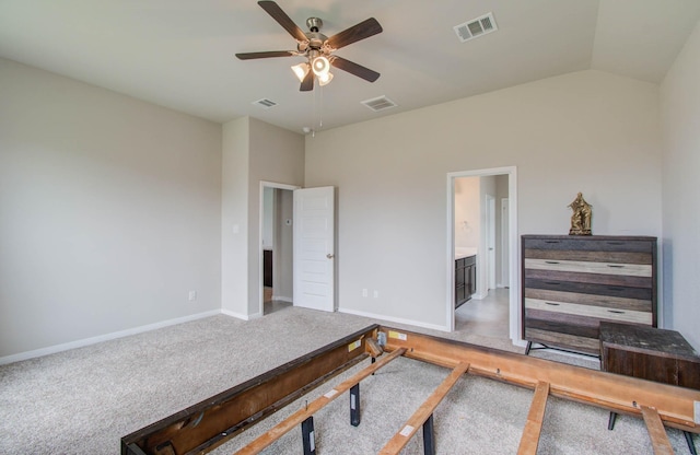 office space with vaulted ceiling, ceiling fan, and carpet floors