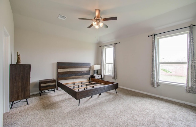 sitting room with ceiling fan and light carpet