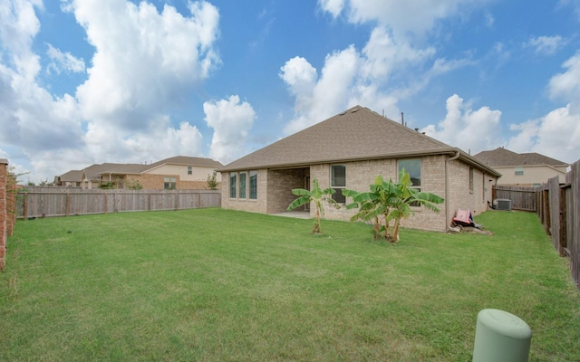 rear view of house with a patio area, a lawn, and central air condition unit