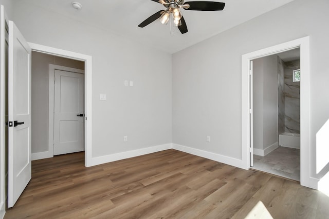 unfurnished bedroom with ceiling fan and light hardwood / wood-style floors