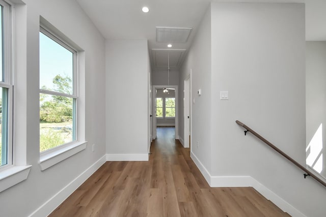 corridor with light hardwood / wood-style flooring