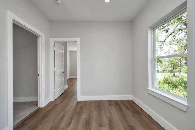 unfurnished room featuring dark hardwood / wood-style flooring