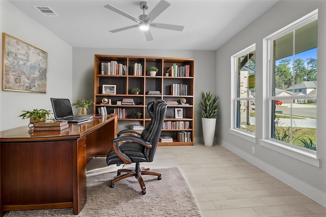 office with ceiling fan, a wealth of natural light, and light hardwood / wood-style flooring