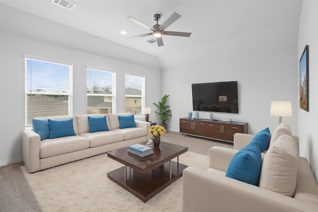 living room featuring a ceiling fan, light carpet, and visible vents