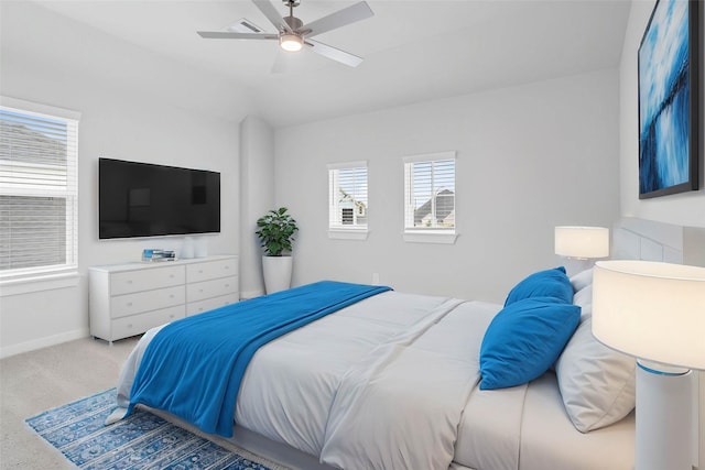 bedroom with baseboards, a ceiling fan, carpet, and vaulted ceiling