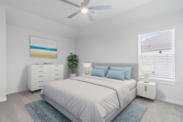 bedroom featuring baseboards, multiple windows, and light colored carpet