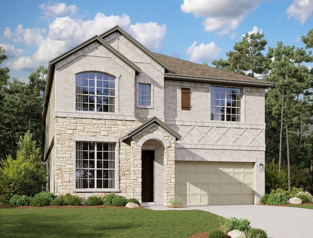 view of front of home with a front yard and a garage