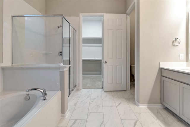 full bathroom featuring toilet, independent shower and bath, and vanity