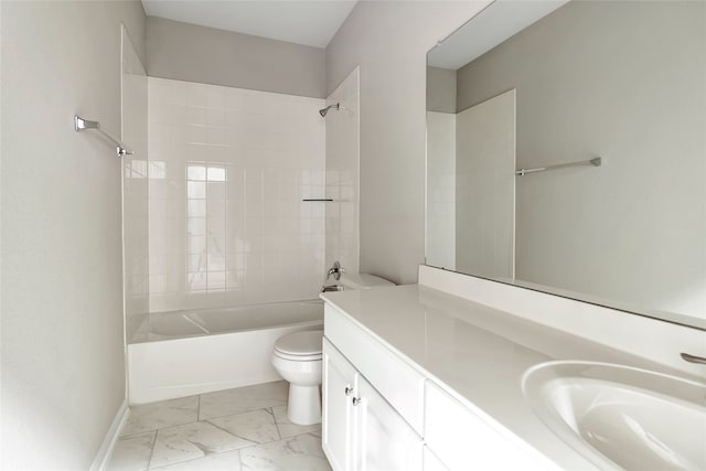 full bathroom with toilet, vanity, and tiled shower / bath