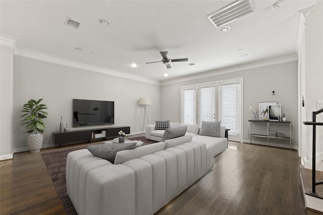 living room with crown molding, ceiling fan, and dark hardwood / wood-style flooring