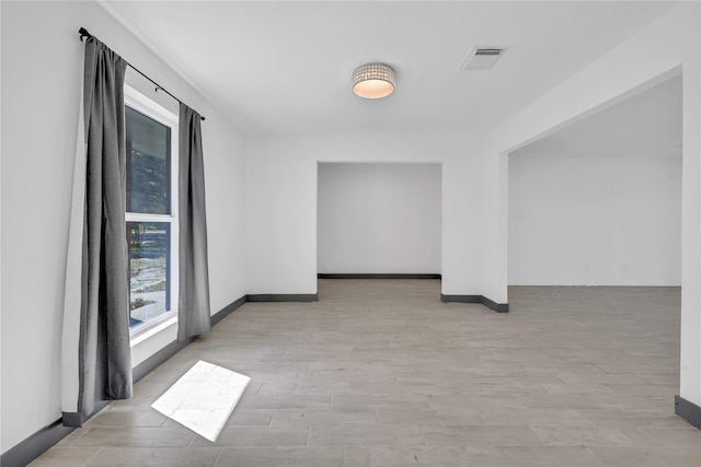 unfurnished room with light hardwood / wood-style floors