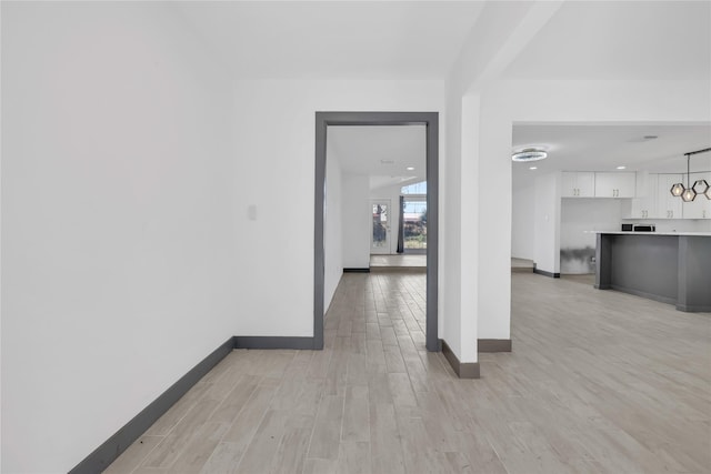 corridor featuring light wood-type flooring