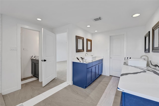 bathroom with vanity and tile patterned flooring