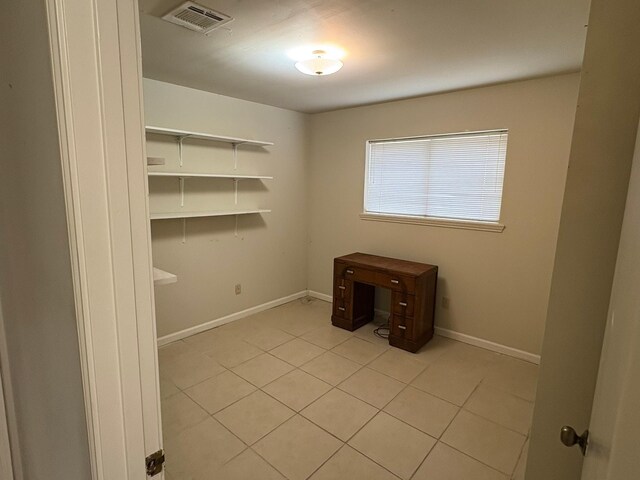 interior space with light tile patterned floors