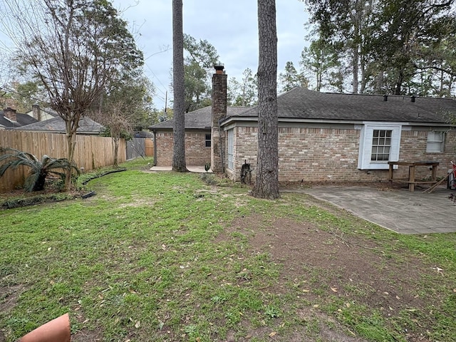 view of yard featuring a patio and a fenced backyard