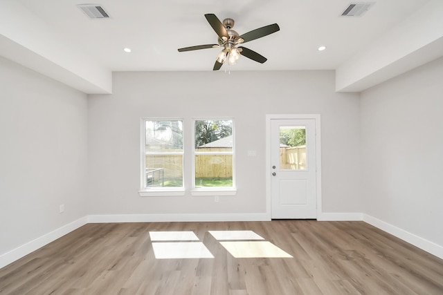 unfurnished living room with light wood-type flooring and ceiling fan