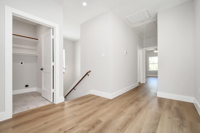 hall with light wood-type flooring