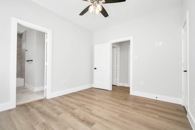 unfurnished bedroom featuring ceiling fan, ensuite bath, and light hardwood / wood-style floors