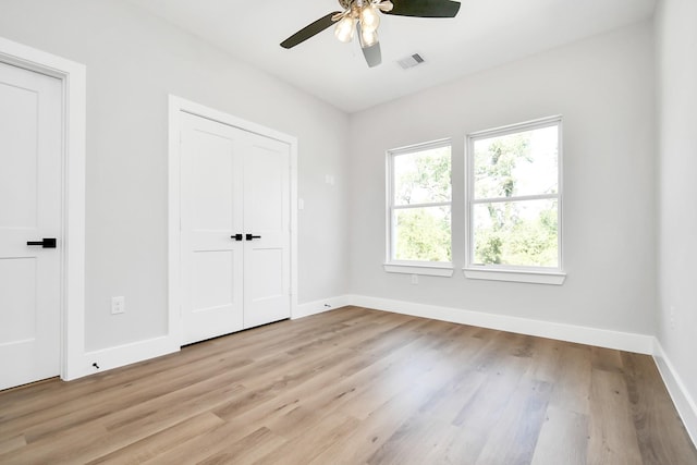 unfurnished bedroom featuring ceiling fan and light hardwood / wood-style flooring