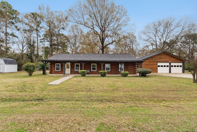 view of front of house with a front yard and a garage