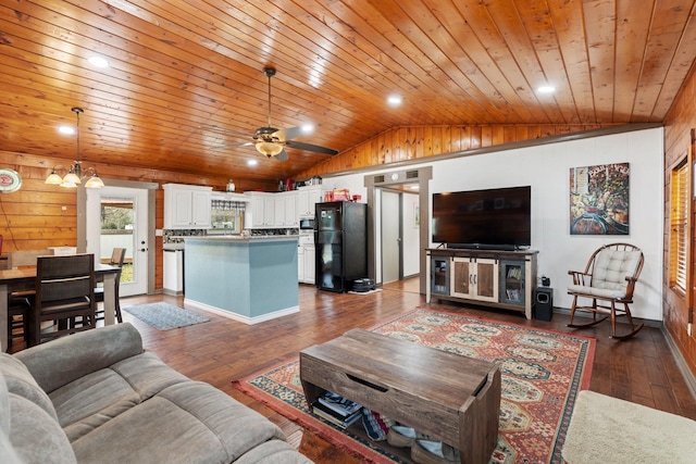 living room with ceiling fan with notable chandelier, wooden ceiling, dark hardwood / wood-style flooring, and lofted ceiling