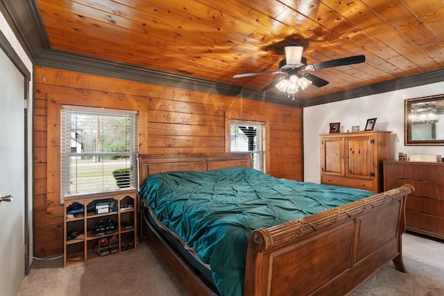 carpeted bedroom with ceiling fan, wooden walls, and wooden ceiling