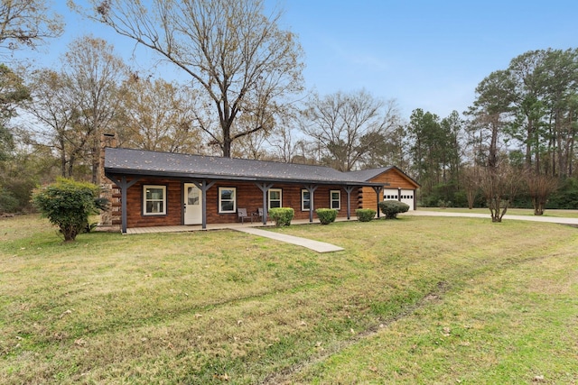 view of front facade with a front yard, a porch, and a garage