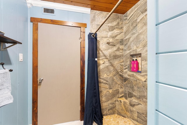 bathroom featuring walk in shower and wooden ceiling