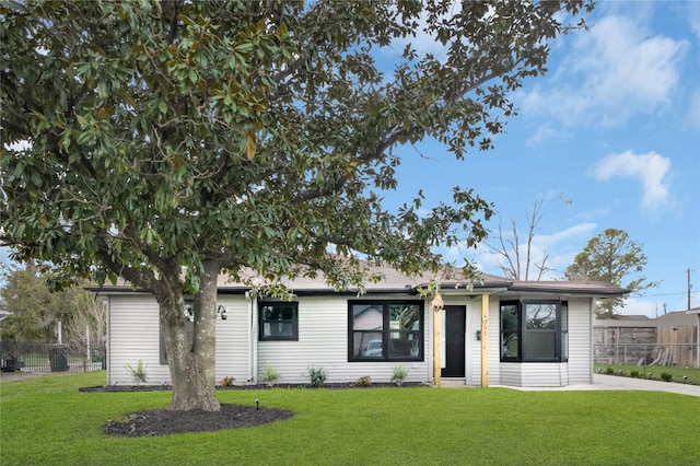 ranch-style house with a front lawn