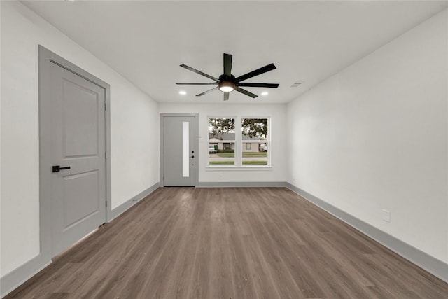 spare room featuring ceiling fan and wood-type flooring