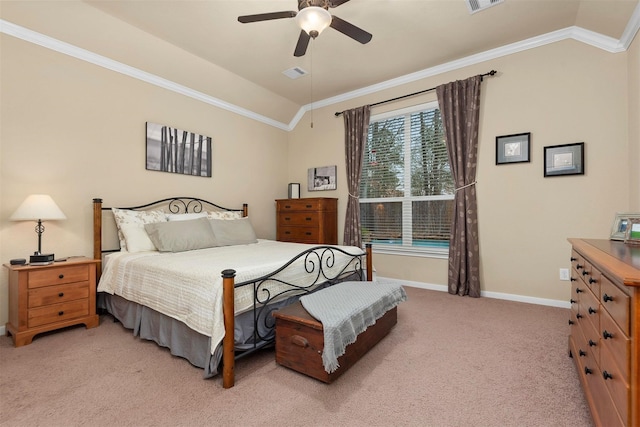 carpeted bedroom featuring crown molding, ceiling fan, and vaulted ceiling