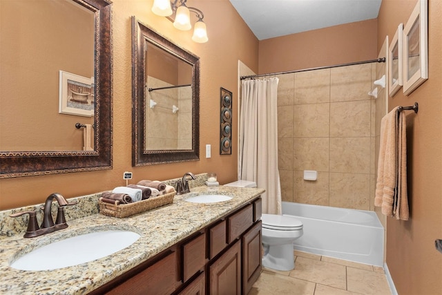 full bathroom with tile patterned flooring, vanity, shower / tub combo, and toilet