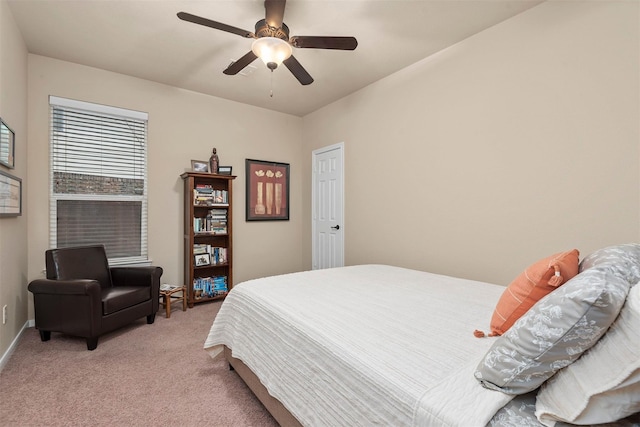 bedroom with ceiling fan and light colored carpet