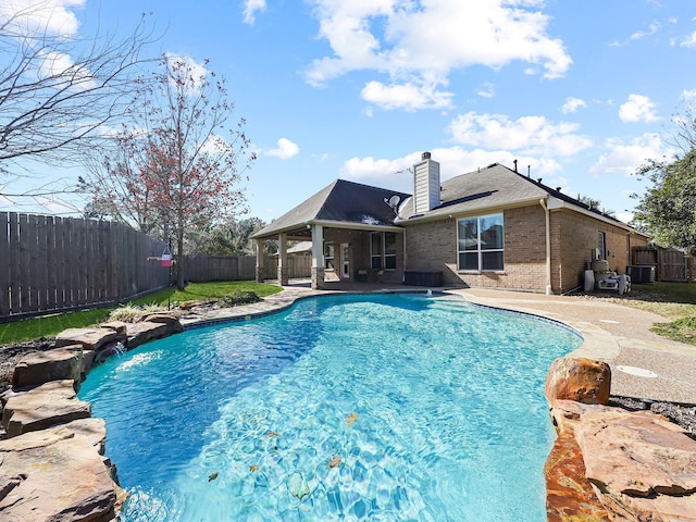 view of pool featuring a patio and pool water feature