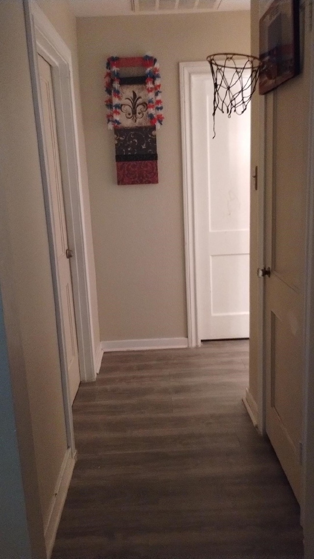 hall with dark hardwood / wood-style flooring